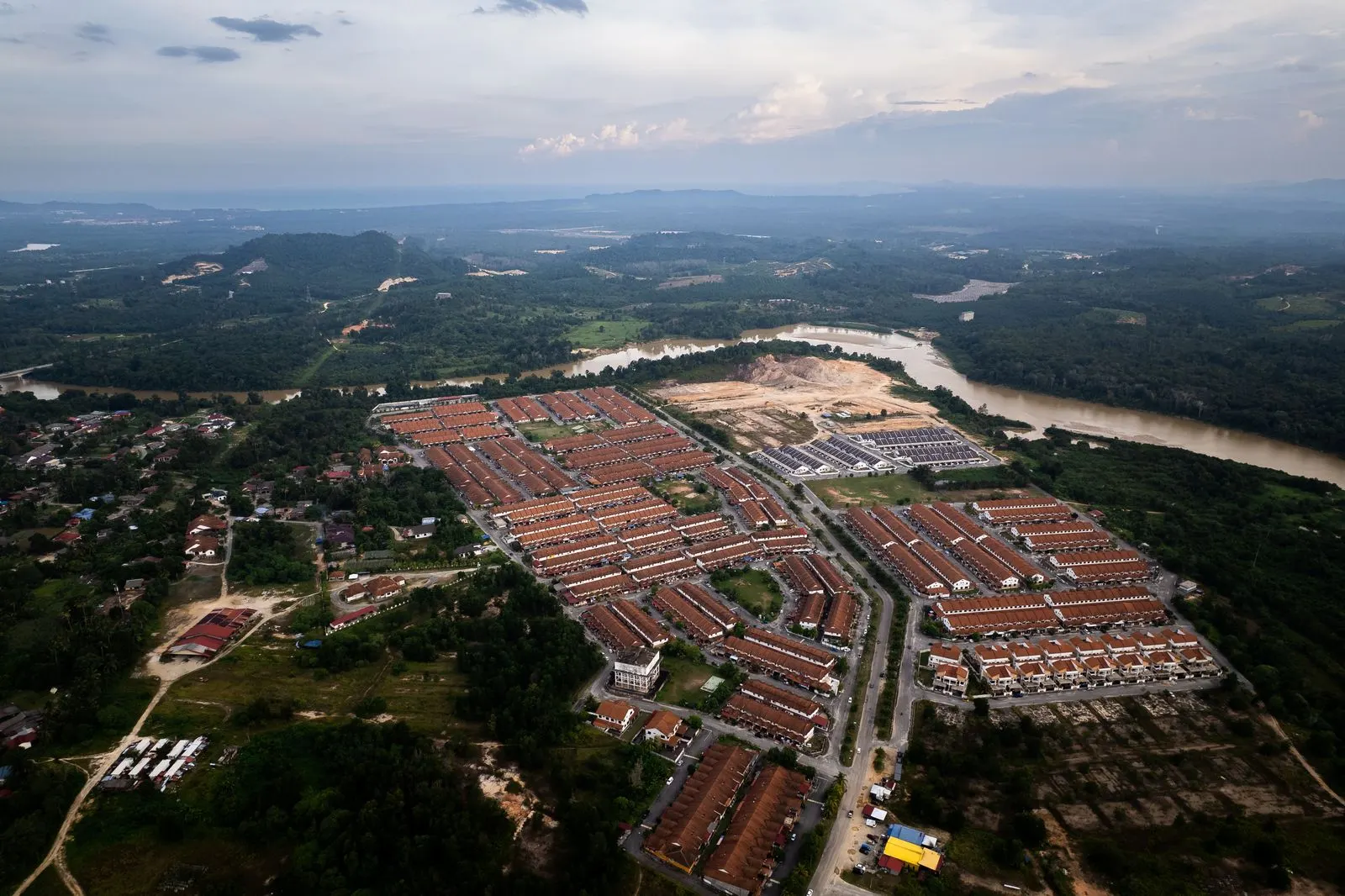 Aerial view of a fast-growing city on the edge of farmland