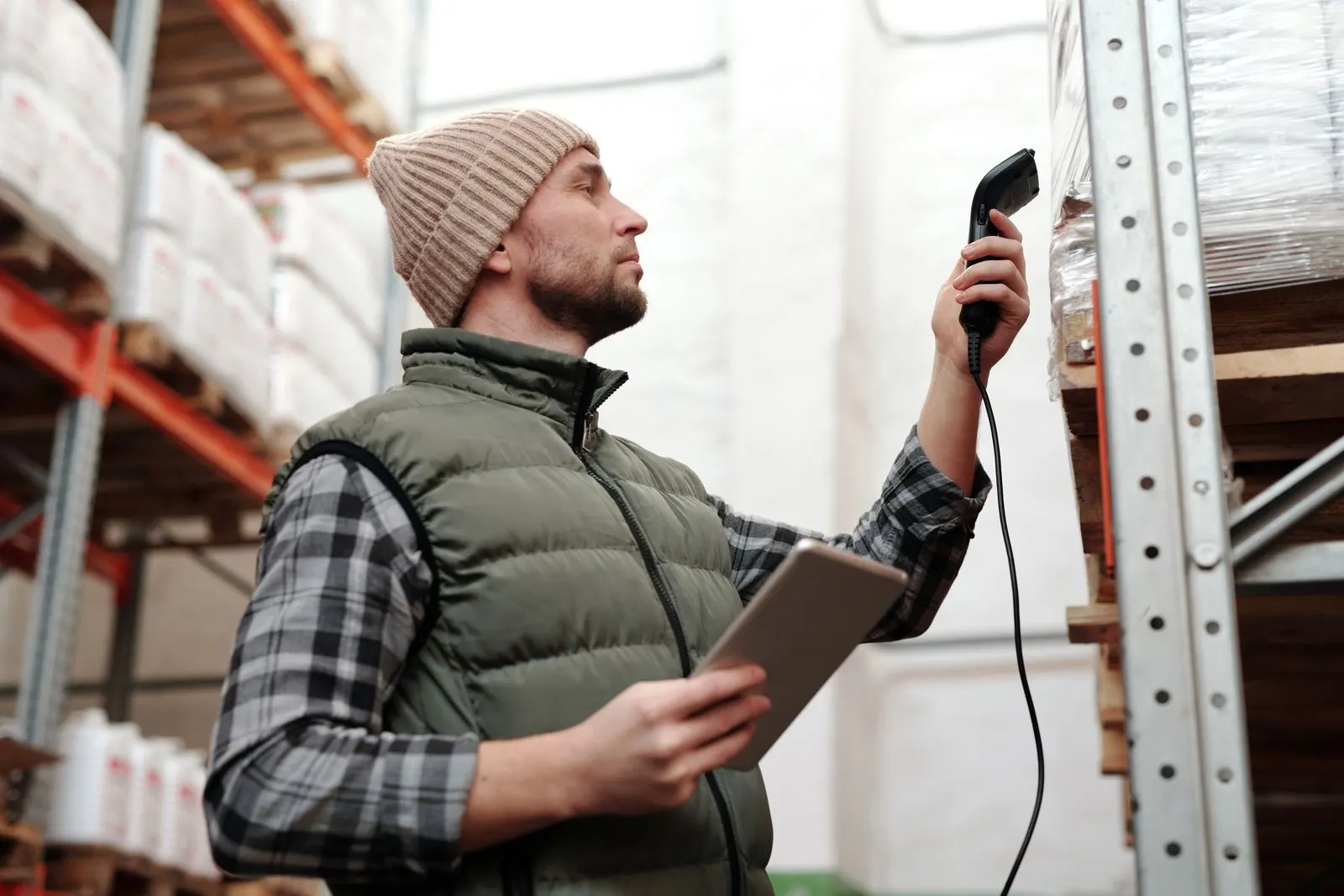 A worker scanning stock on site