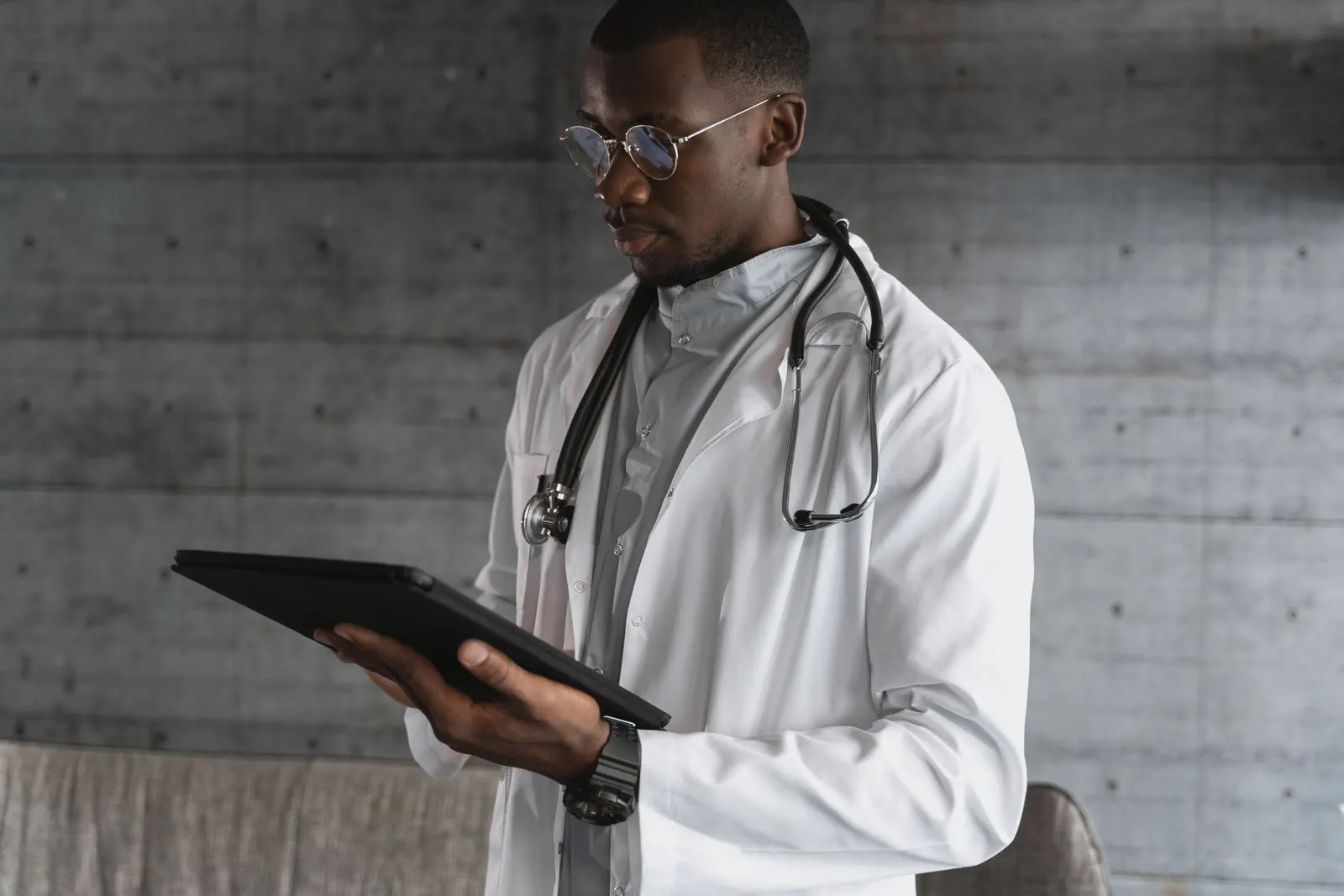 A clinician using a tablet at the point of care
