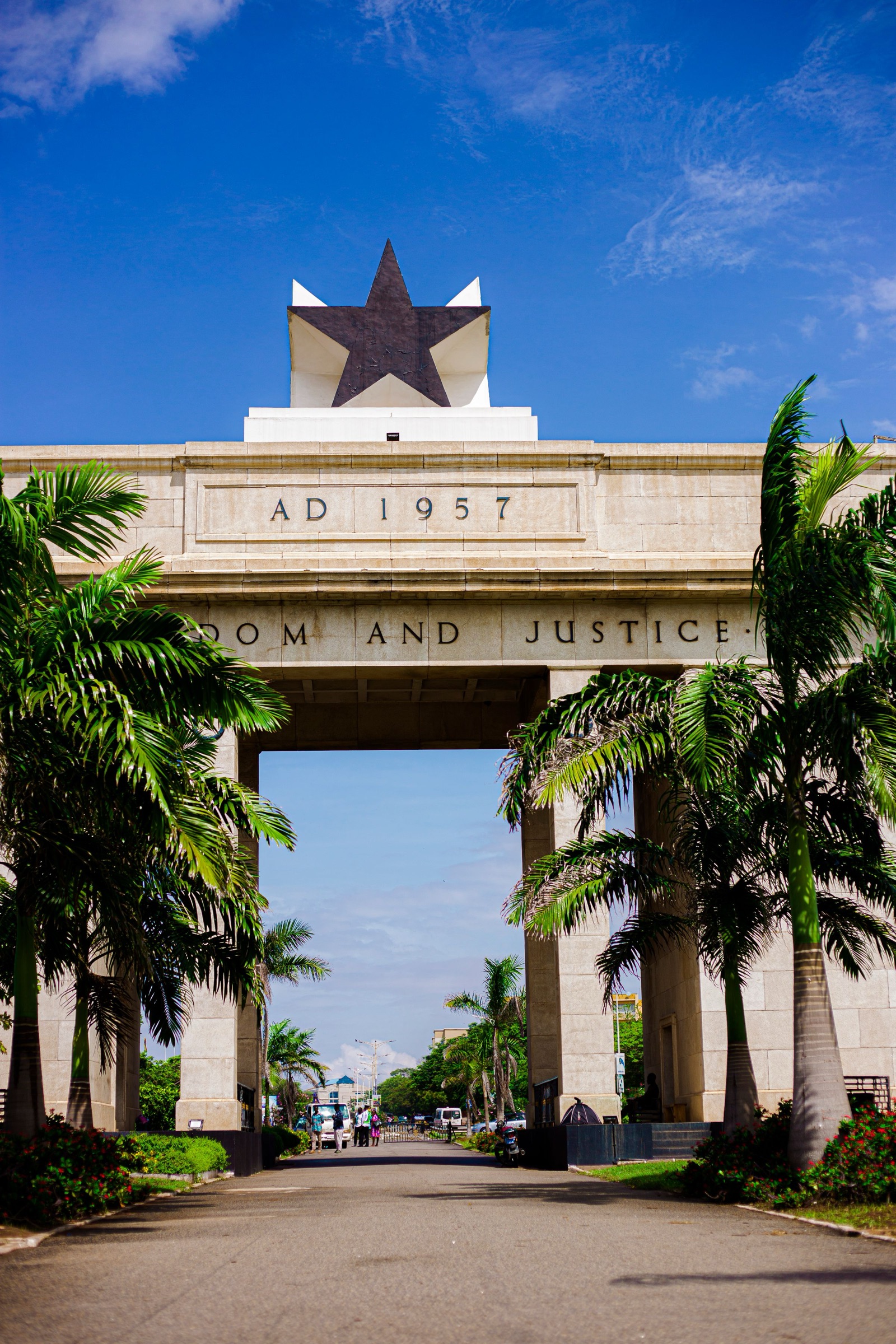 Independence Arch in Accra against a deep blue sky