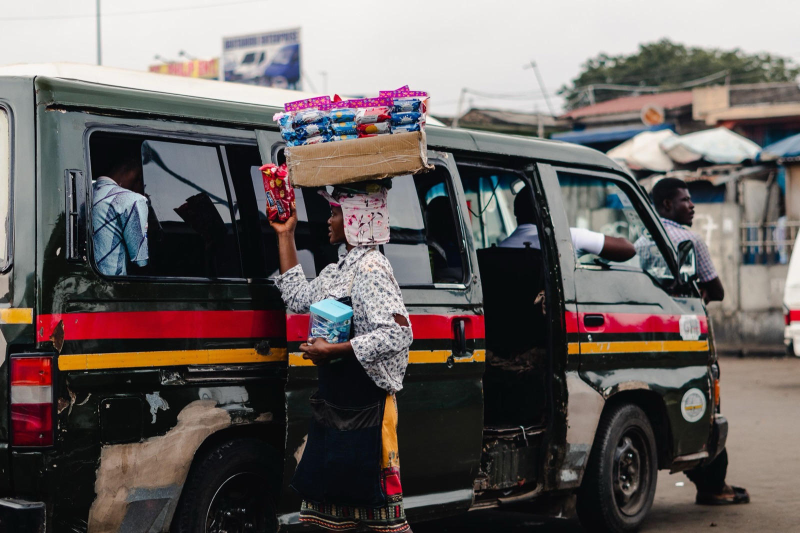 A street vendor selling to tro-tro passengers in Ghana
